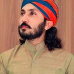 विधायक भाटी और भजन गायक रावणा के बीच बढ़ता विवाद दर्शाता हुआ इमेज